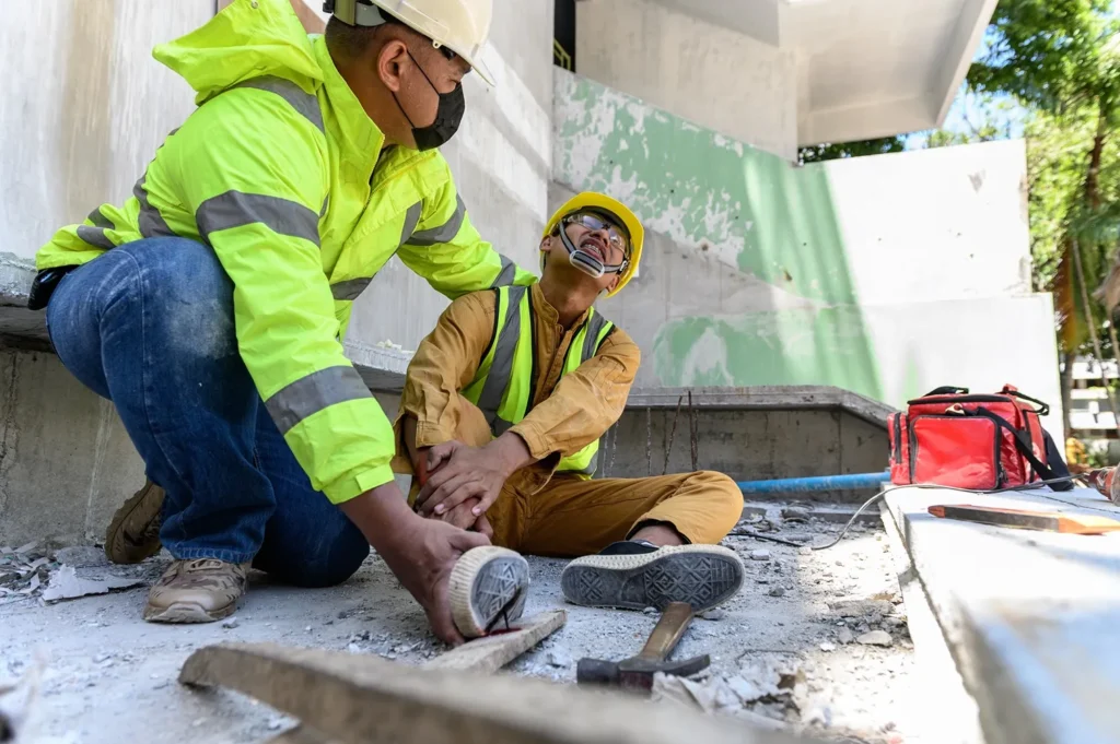 A coworker assisting an employee who was injured at work.