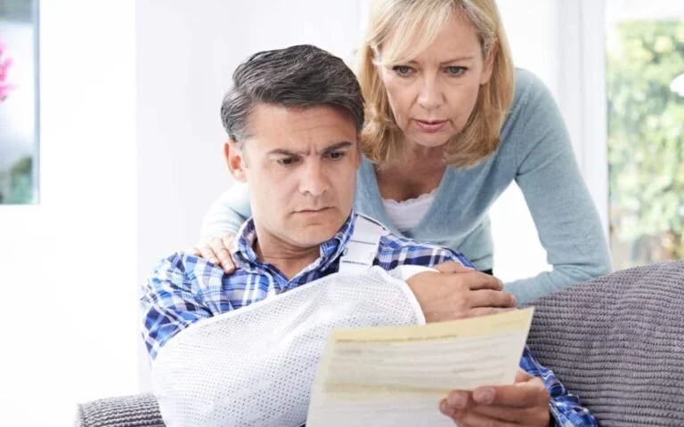 Couple looking at insurance claim.