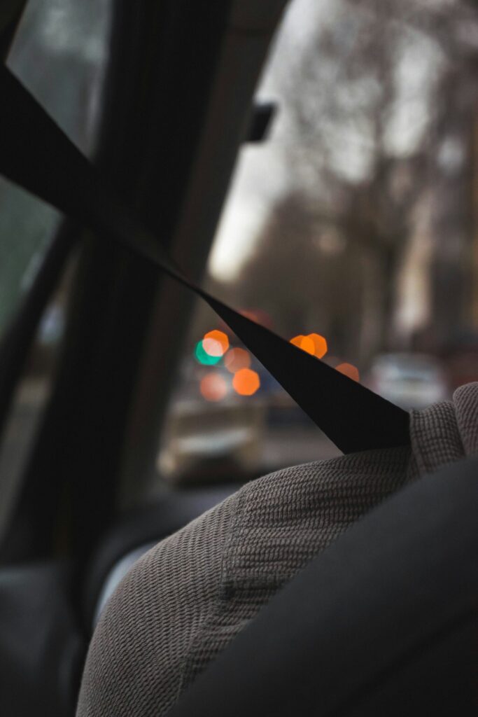 Side view of a man with seatbelt on.