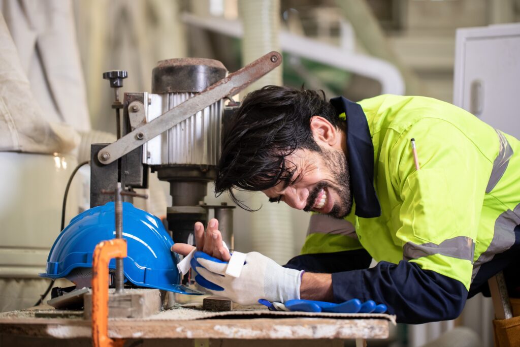 A warehouse worker injuring their hand.