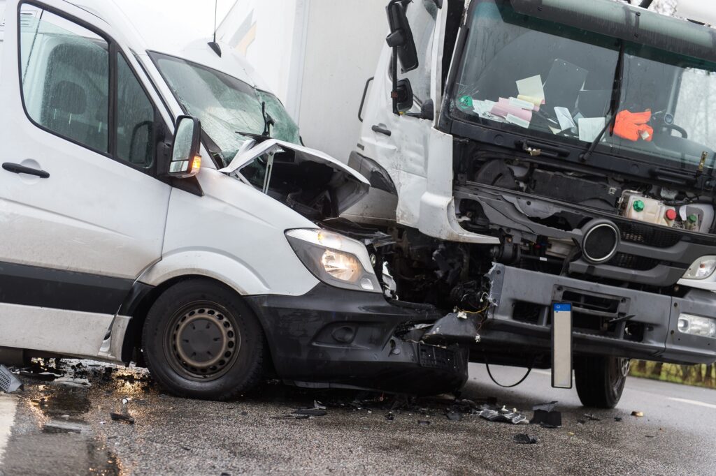 A van and semi smashed together after an accident.