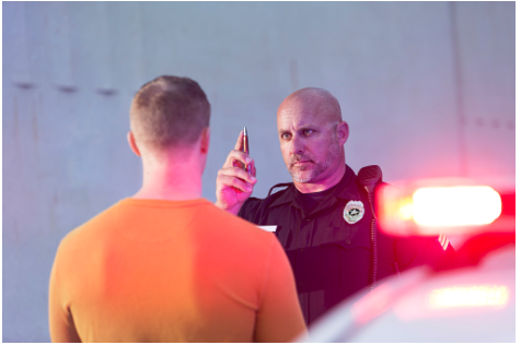 Police officer giving a field sobriety test.