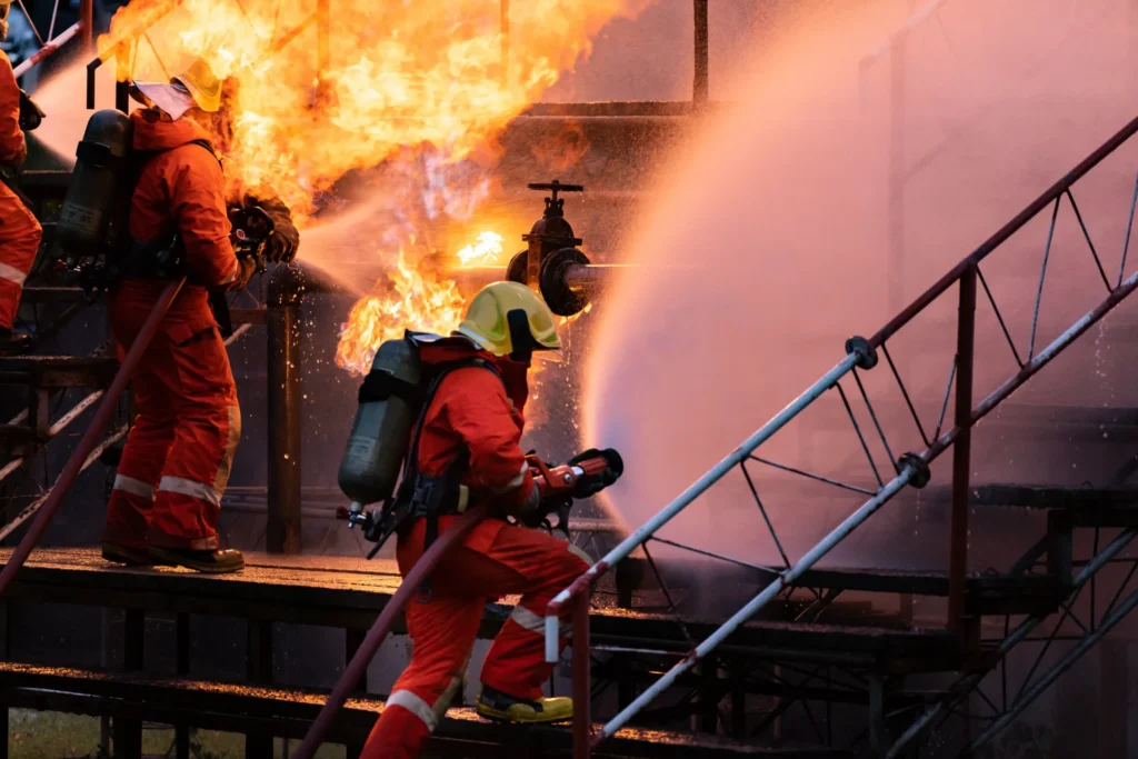 Oil field explosion fire being handled by firefighters.